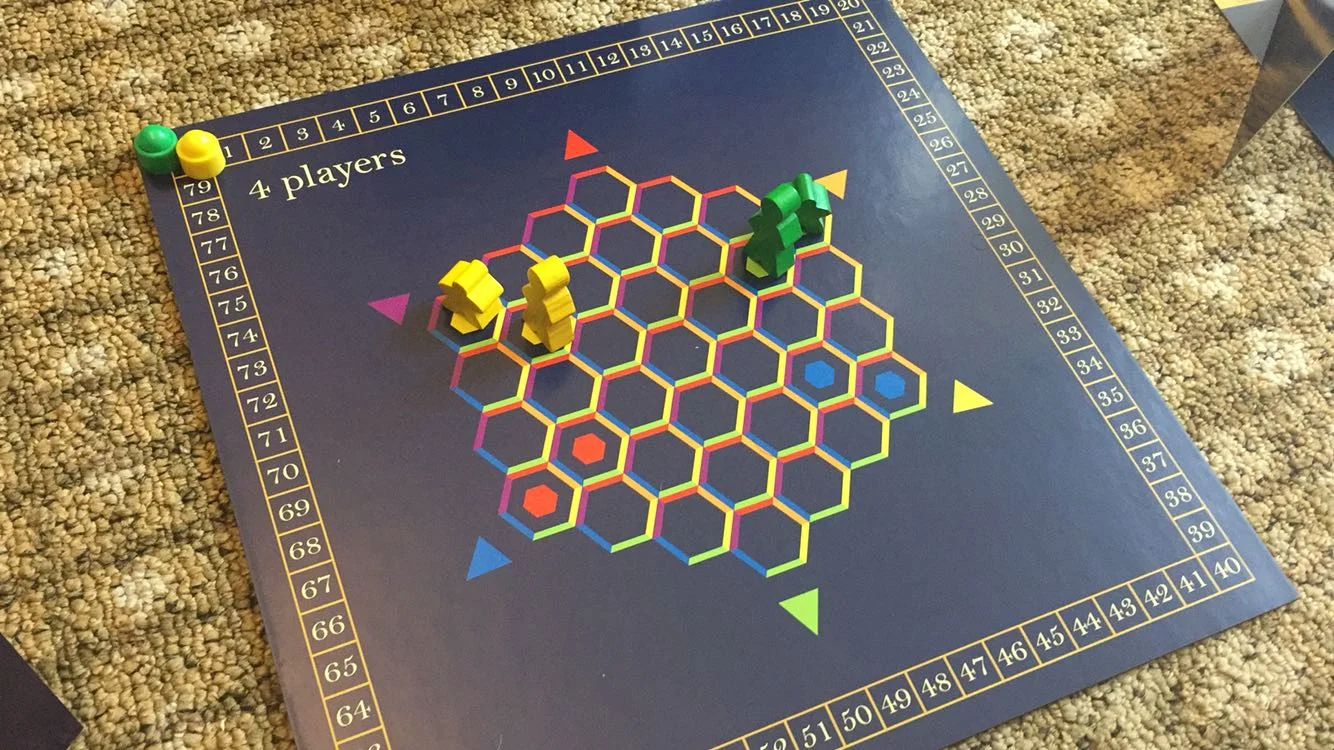 Close-up of the central hex board showing player pawns and colored dance move markers